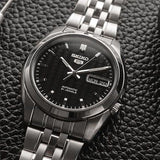 Seiko SNK361K1 Herrenuhr Automatik Schwarz Zifferblatt Stahlarmband